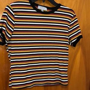 Women’s Stripped tee shirt. Size: Medium